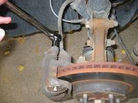 Removing top Maxima front brake caliper nut